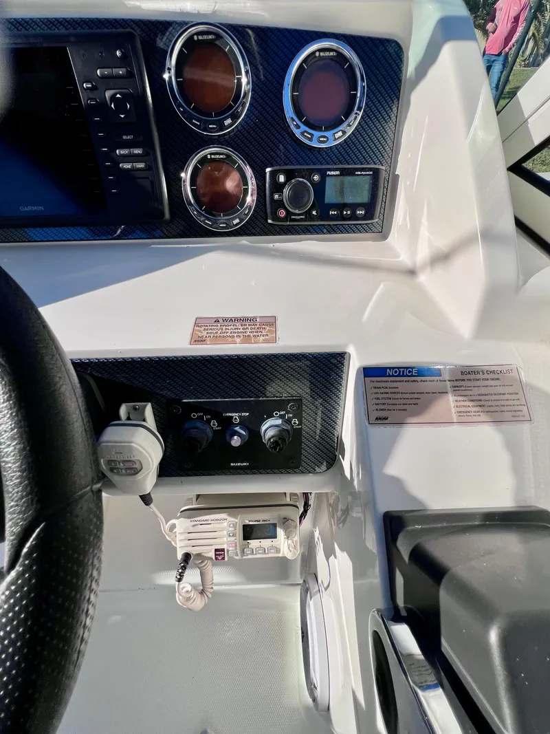 Slide: The Image of 2015 Carolina Cat 23 SD dashboard with gauges and controls. - 10