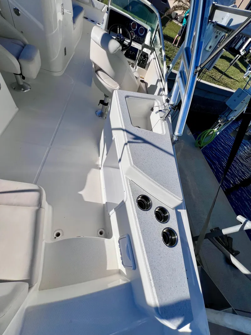Slide: The Image of 2015 Carolina Cat 23 SD boat interior with seating and console. - 15