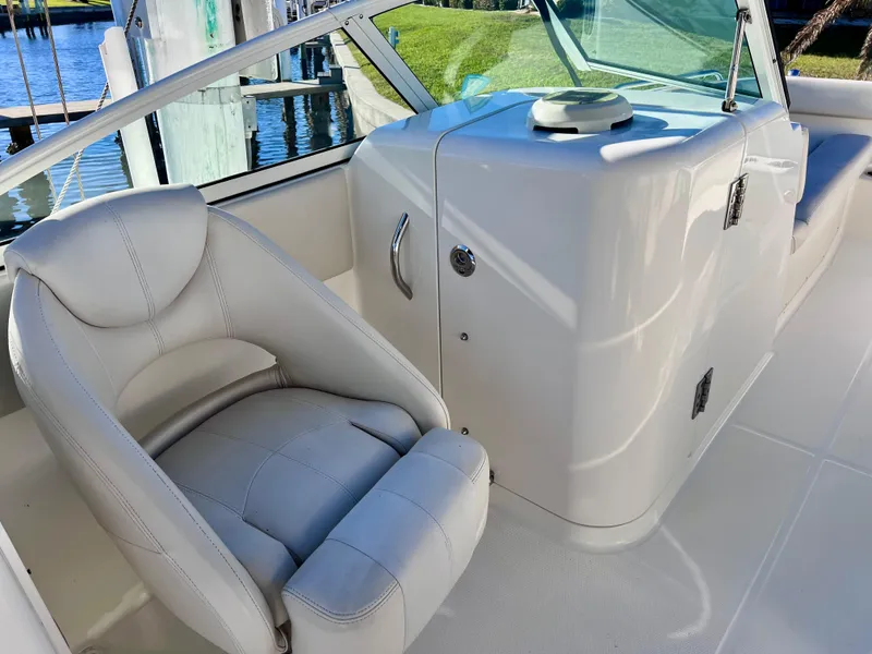 Slide: The Image of 2015 Carolina Cat 23 SD boat interior with white seating and console. - 16