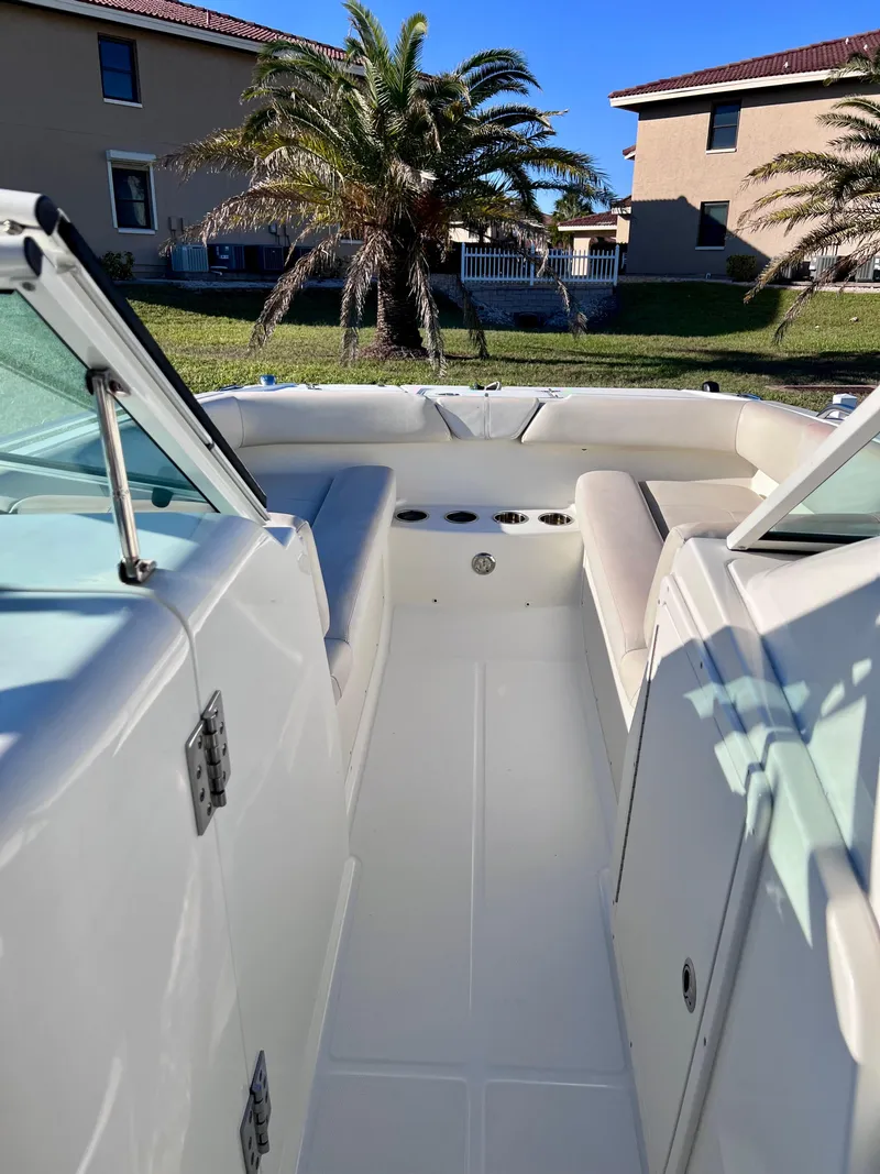 Slide: The Image of 2015 Carolina Cat 23 SD boat interior with seating and cup holders. - 18