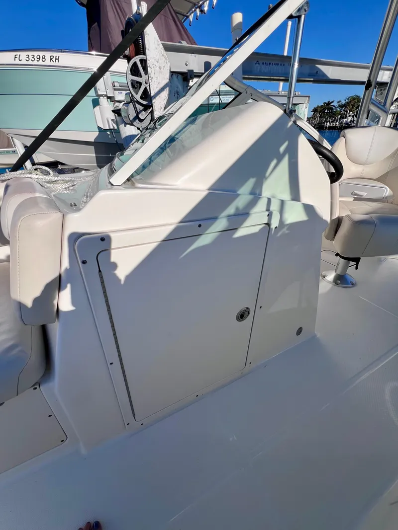 Slide: The Image of 2015 Carolina Cat 23 SD boat interior with seating and steering wheel. - 25