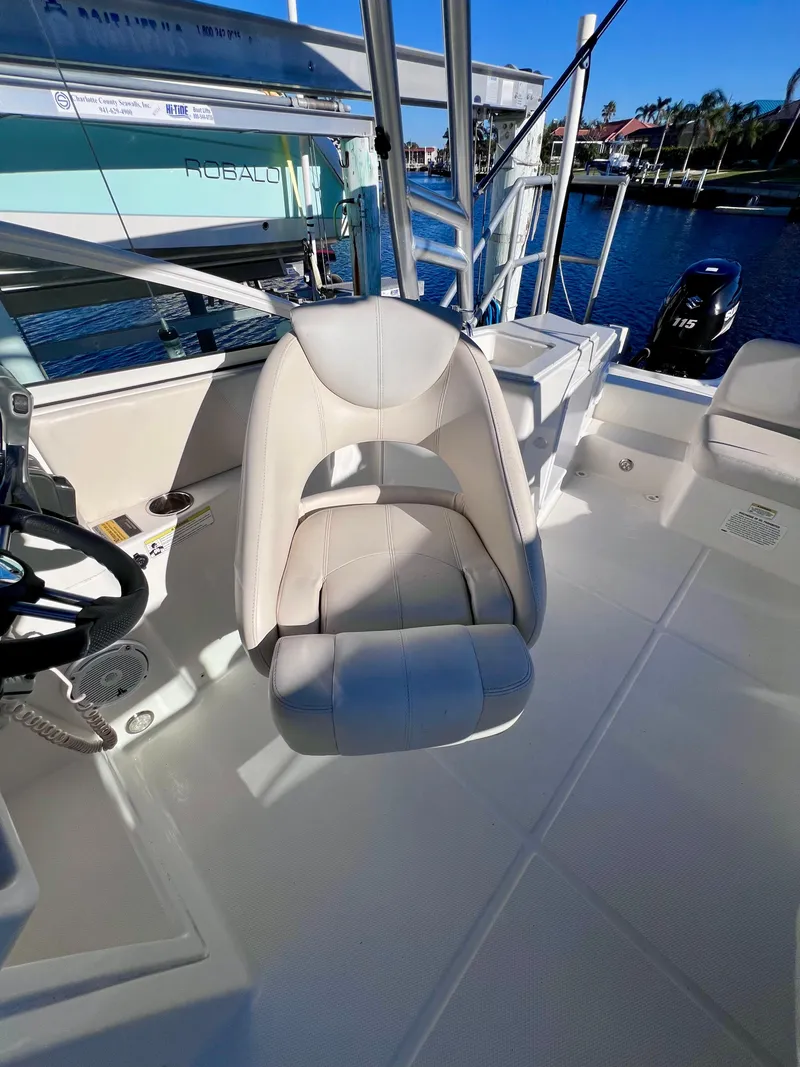 Slide: The Image of Carolina Cat 23 SD 2015 boat interior with steering wheel and seating. - 27