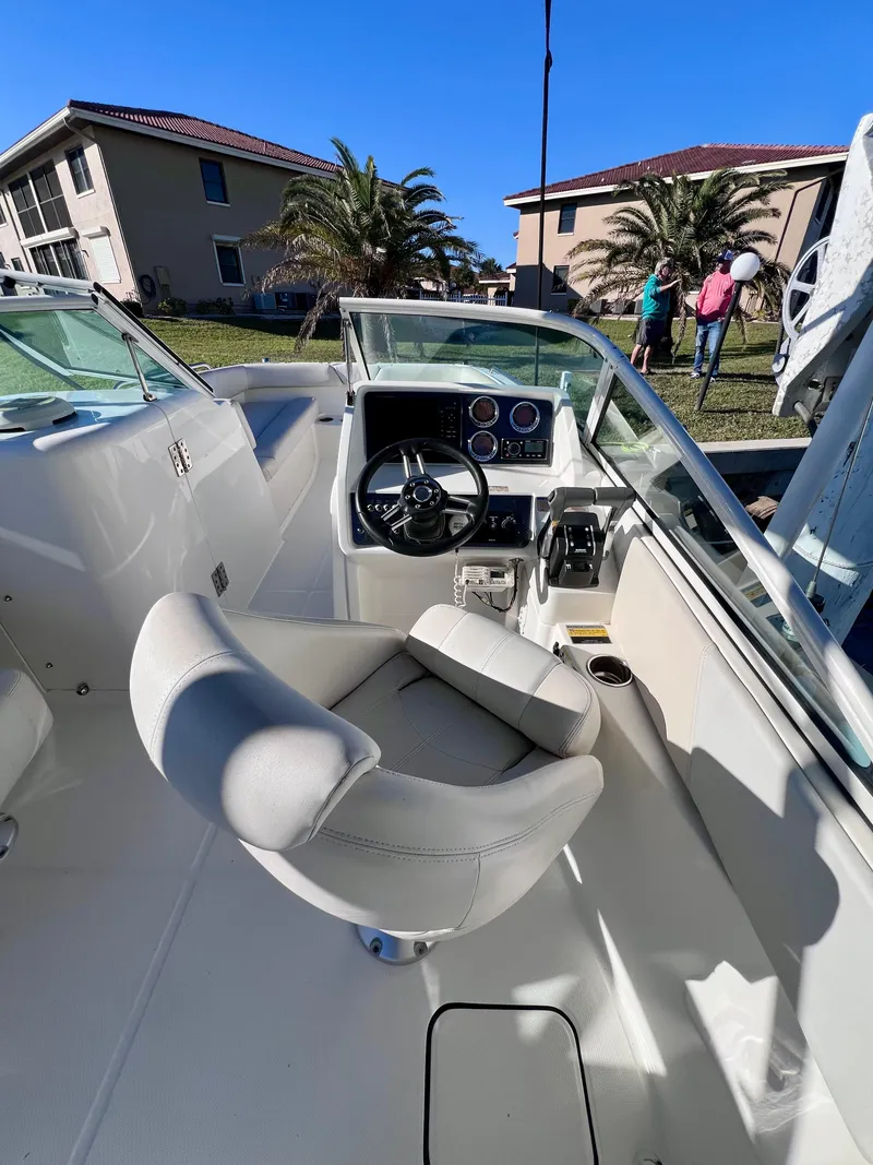 Slide: The Image of 2015 Carolina Cat 23 SD boat interior with steering wheel and seating. - 6