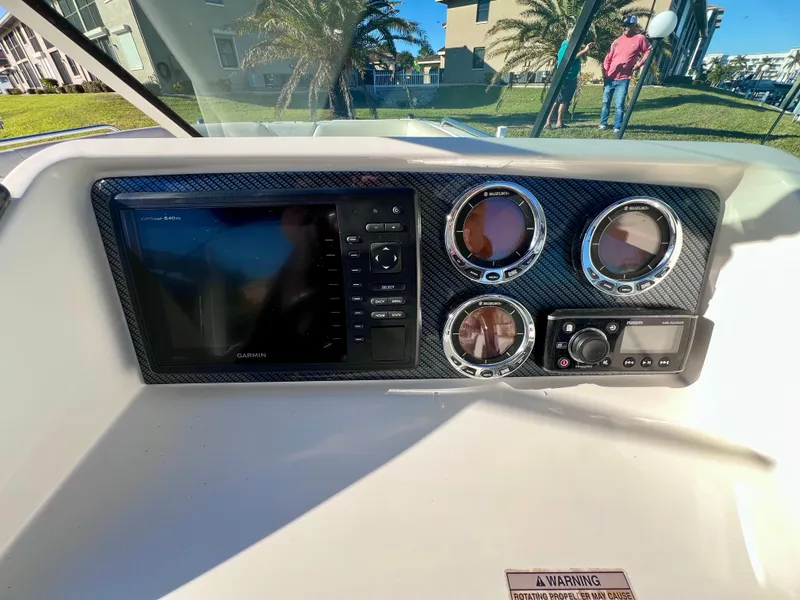 Slide: The Image of Dashboard of 2015 Carolina Cat 23 SD with Garmin display and gauges. - 9