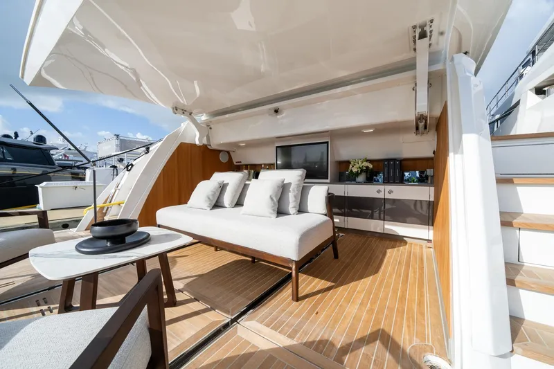 Slide: The Image of Luxurious Pearl 95 yacht interior, 2025 model, featuring elegant seating and modern design. - 15