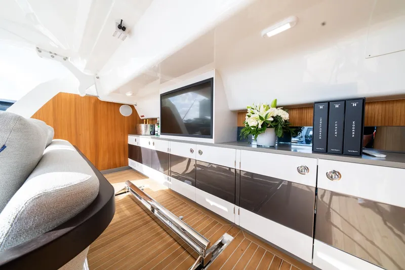 Slide: The Image of Luxurious interior of 2025 Pearl 95 yacht with modern cabinetry and elegant decor. - 16