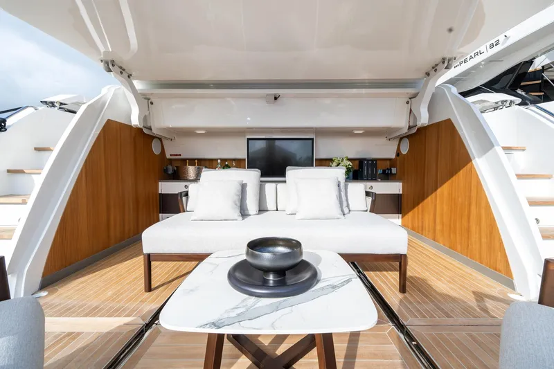 Slide: The Image of Luxurious interior of 2025 Pearl 95 yacht with elegant seating and modern decor. - 17