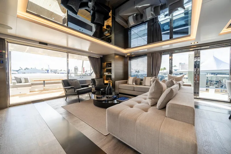 Slide: The Image of Luxurious interior of 2025 Pearl 95 yacht with modern furnishings and panoramic windows. - 27
