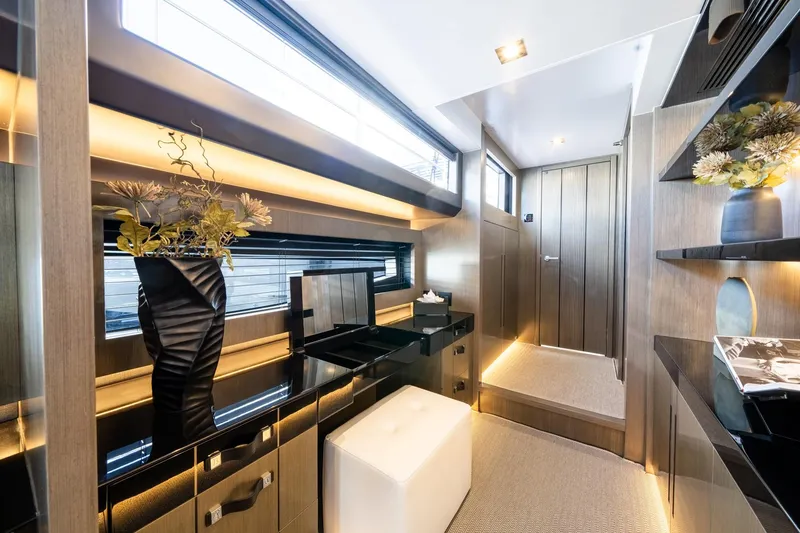 Slide: The Image of Luxurious interior of 2025 Pearl 95 yacht with modern decor and elegant lighting. - 38