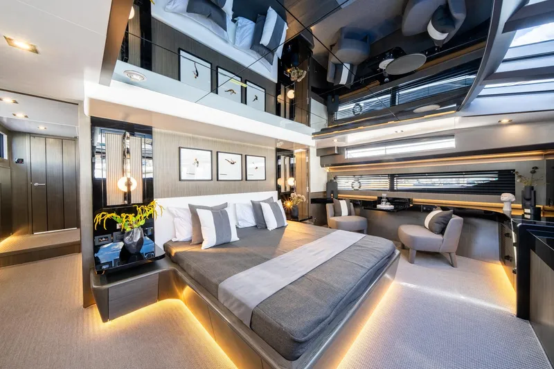 Slide: The Image of Luxurious bedroom interior of 2025 Pearl 95 yacht with modern design and ambient lighting. - 43