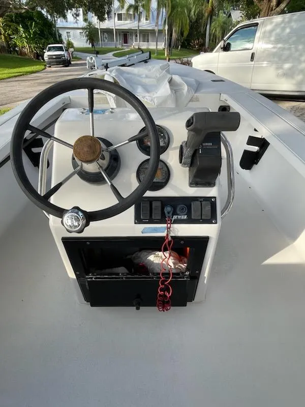 Slide: The Image of 1998 Hewes Bayfisher boat console with steering wheel and controls. - 9
