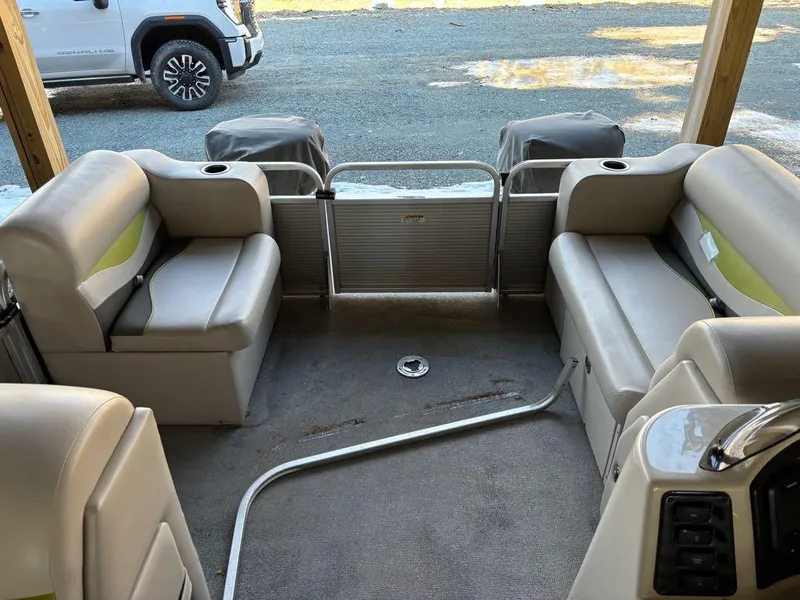 Slide: The Image of 2015 Apex Marine Qwest Adventure 820 Sport Cruise interior with seating and controls. - 10