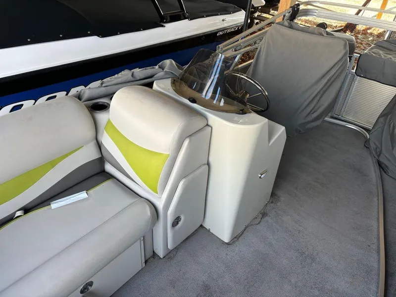 Slide: The Image of 2015 Apex Marine Qwest Adventure 820 Sport Cruise Adv interior with seating and steering console. - 13