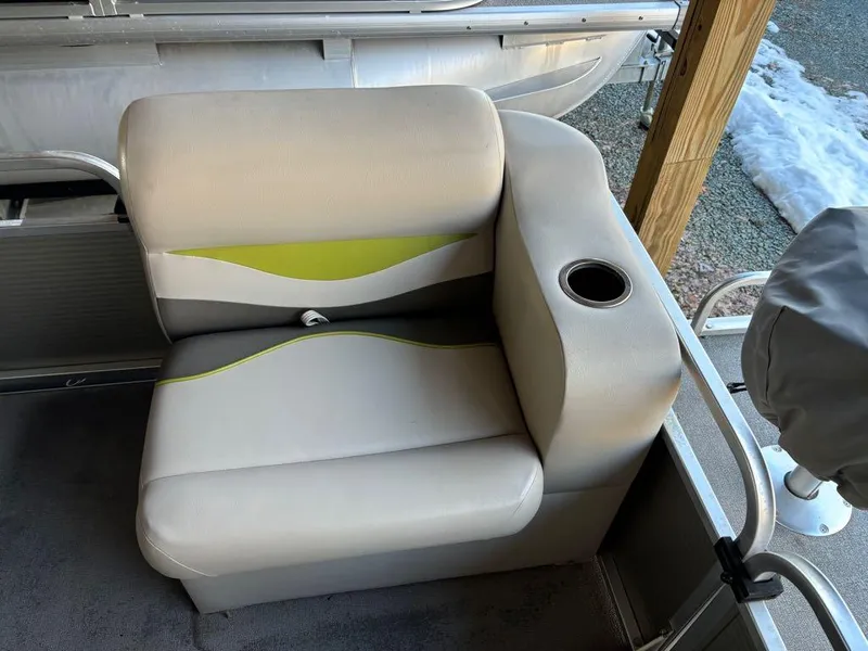 Slide: The Image of 2015 Apex Marine Qwest Adventure 820 Sport Cruise seat with cup holder, beige and green accents. - 6
