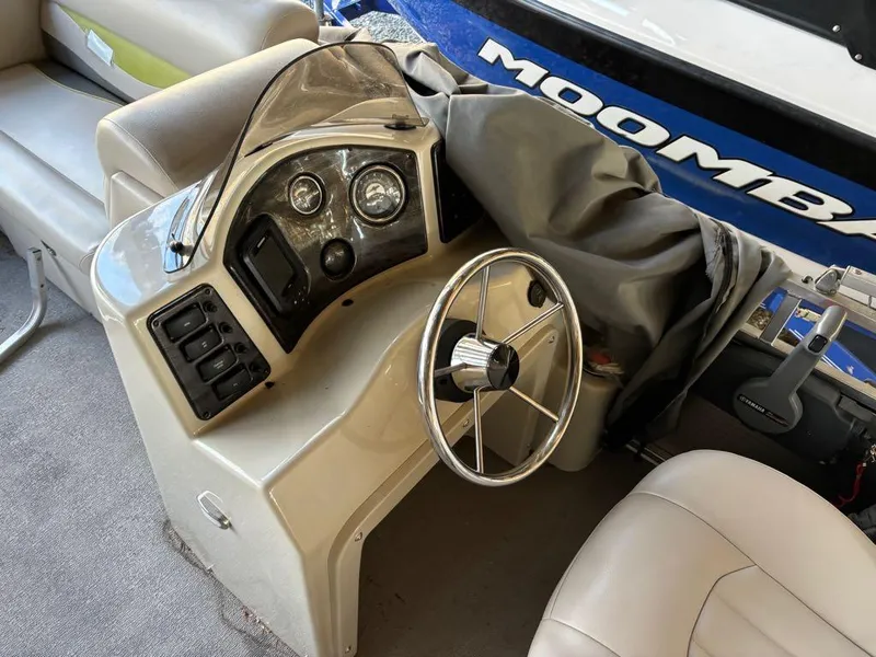 Slide: The Image of 2015 Apex Marine Qwest Adventure 820 Sport Cruise Adv boat dashboard and steering wheel. - 7