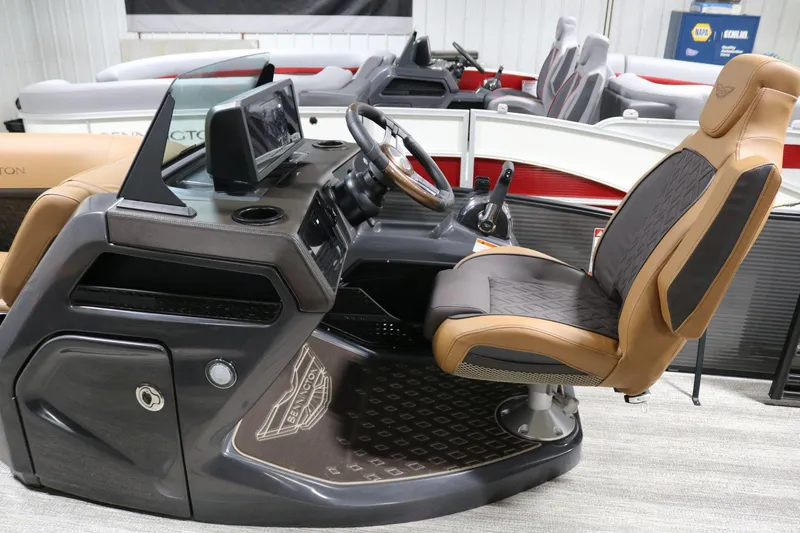 Slide: The Image of 2025 Bennington 22 M Swingback boat interior with captain's chair and dashboard. - 14