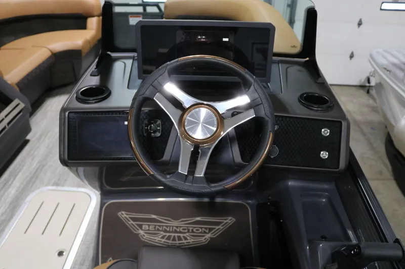 Slide: The Image of 2025 Bennington 22 M Swingback steering console with modern design and controls. - 15