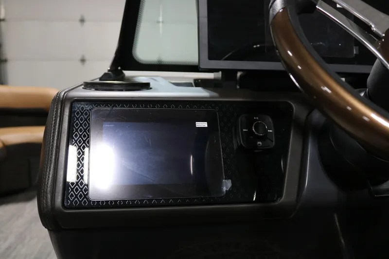 Slide: The Image of Dashboard of 2025 Bennington 22 M Swingback with touchscreen and steering wheel. - 16