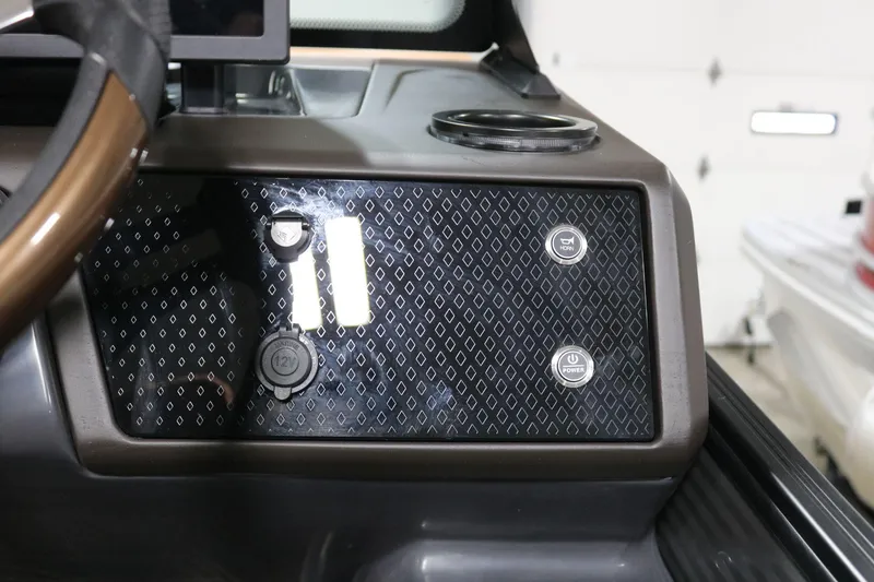 Slide: The Image of Dashboard of 2025 Bennington 22 M Swingback with horn and power buttons. - 18