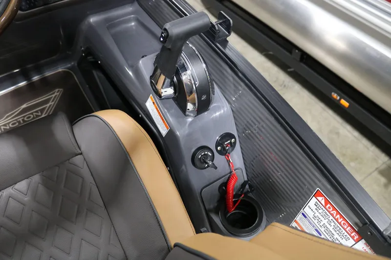Slide: The Image of 2025 Bennington 22 M Swingback boat control panel with throttle and warning labels. - 19