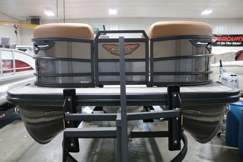 Slide: The Image of 2025 Bennington 22 M Swingback pontoon boat in showroom, rear view. - 3