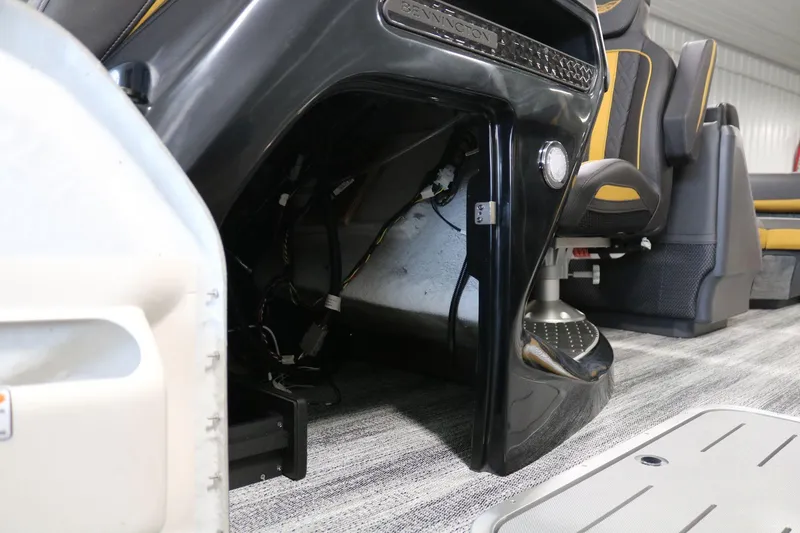 Slide: The Image of Interior view of 2025 Bennington 22 M FASTBACK boat, showcasing seating and wiring details. - 10