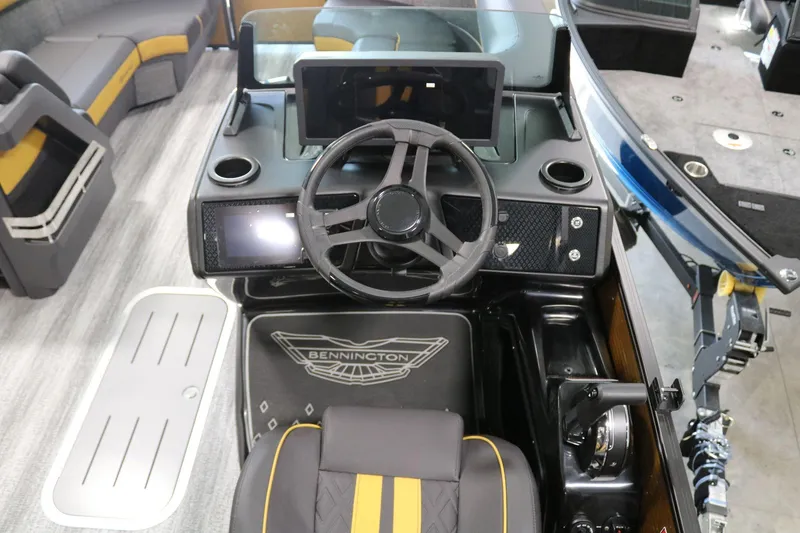 Slide: The Image of 2025 Bennington 22 M FASTBACK boat interior with steering wheel and seating. - 17