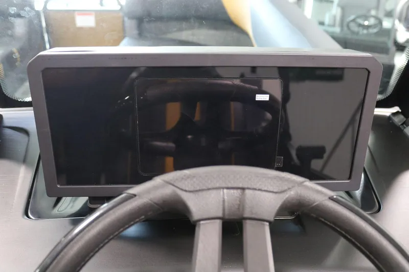 Slide: The Image of Dashboard of 2025 Bennington 22 M FASTBACK with modern steering wheel and display. - 20