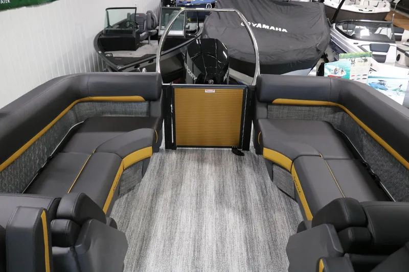 Slide: The Image of 2025 Bennington 22 M FASTBACK boat interior with sleek seating and modern design. - 23