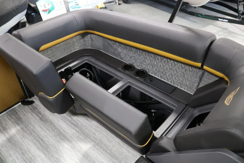 Slide: The Image of 2025 Bennington 22 M FASTBACK boat interior with storage compartments and cup holders. - 25
