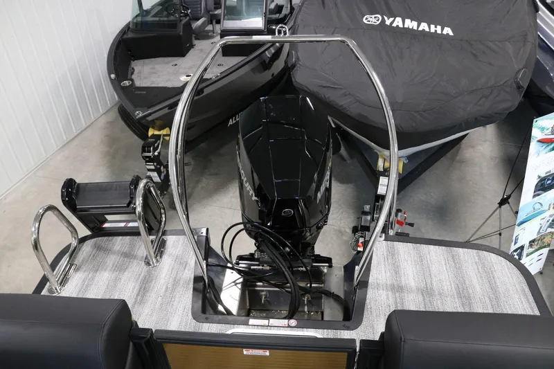 Slide: The Image of 2025 Bennington 22 M FASTBACK boat with Mercury engine in showroom. - 26