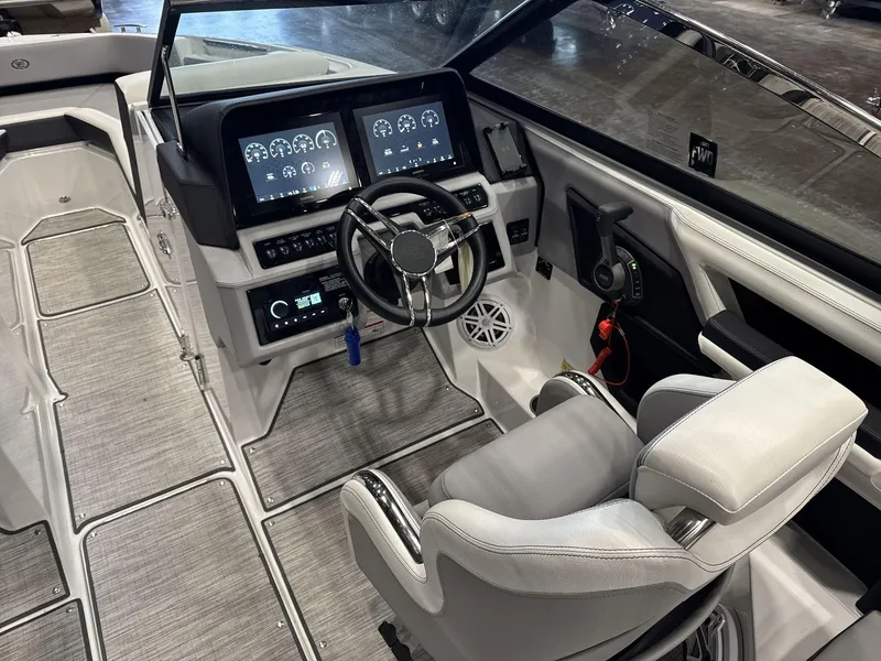 Slide: The Image of 2024 Cobalt R4 Surf boat interior with modern dashboard and steering wheel. - 10