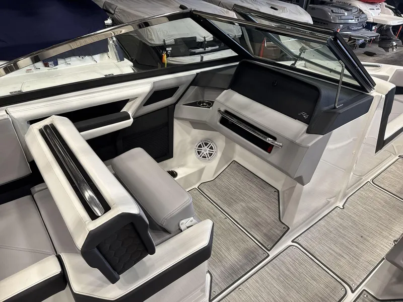 Slide: The Image of 2024 Cobalt R4 Surf boat interior with sleek seating and modern dashboard design. - 12