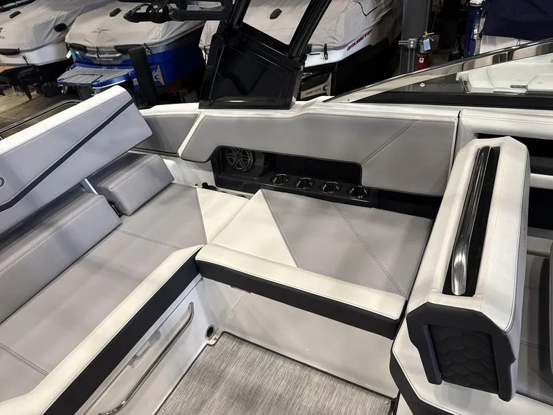 Slide: The Image of 2024 Cobalt R4 Surf boat interior with sleek seating and cup holders. - 13