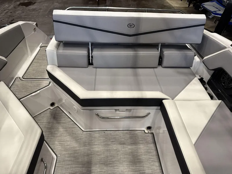Slide: The Image of 2024 Cobalt R4 Surf boat interior with sleek gray seating and modern design. - 14