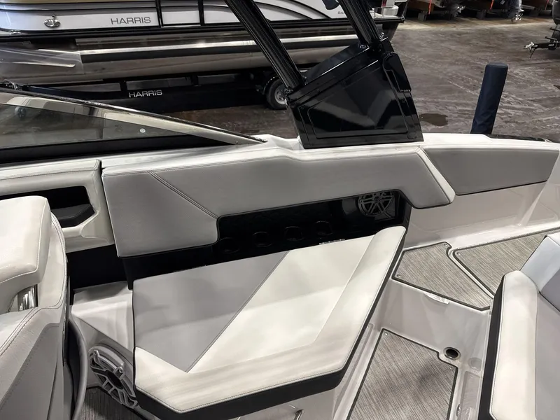 Slide: The Image of 2024 Cobalt R4 Surf boat interior with sleek white seating and modern design. - 15