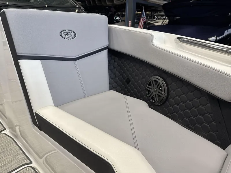 Slide: The Image of 2024 Cobalt R4 Surf boat interior with stylish seating and speaker detail. - 16