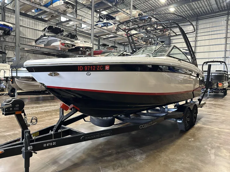 Slide: The Image of 2024 Cobalt R4 Surf boat on trailer in indoor storage facility. - 3