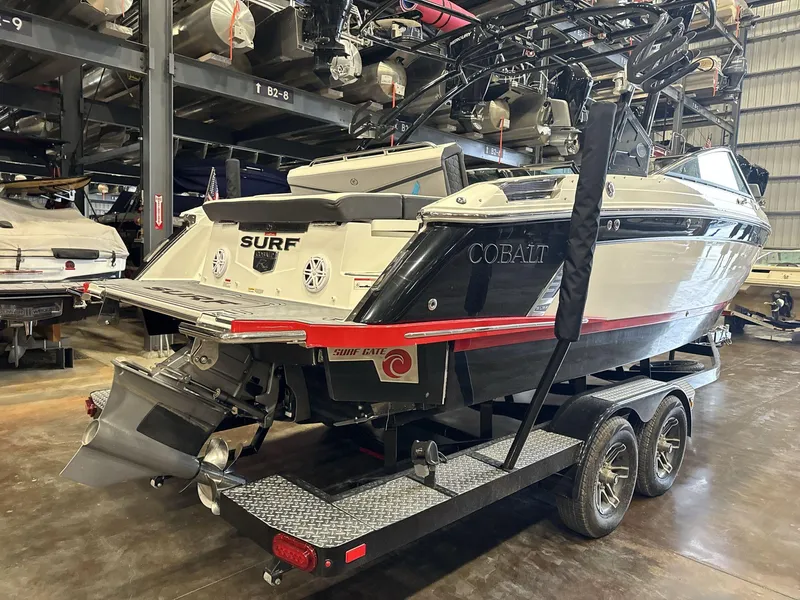 Slide: The Image of 2024 Cobalt R4 Surf boat on trailer in storage facility. - 6