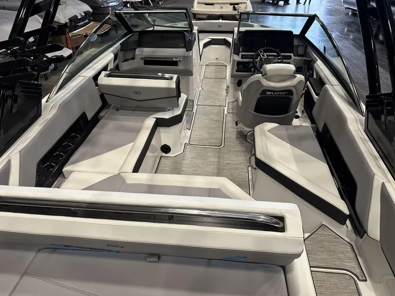Slide: The Image of 2024 Cobalt R4 Surf boat interior with modern seating and sleek design. - 7