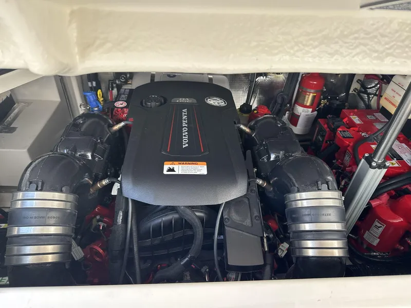 Slide: The Image of 2023 Regal 28EX boat engine compartment with Volvo Penta engine. - 21