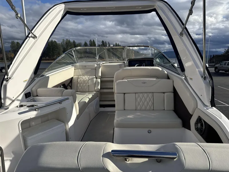 Slide: The Image of 2023 Regal 28EX boat interior with luxurious white seating and modern design. - 8