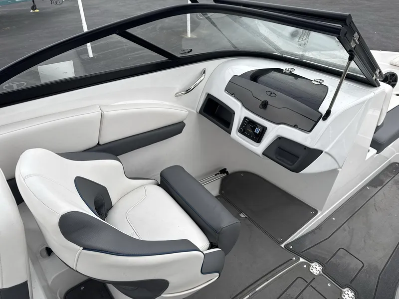 Slide: The Image of Interior of 2022 Tahoe 210 S boat with sleek white and gray seating. - 12