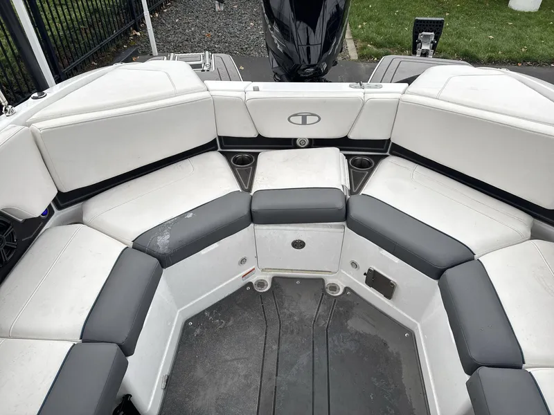 Slide: The Image of 2022 Tahoe 210 S boat interior with white and gray seating. - 14