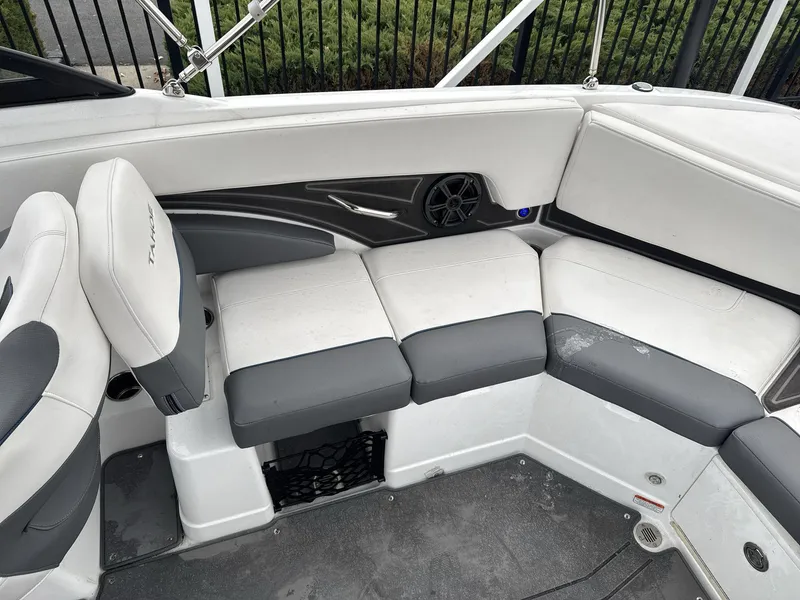 Slide: The Image of 2022 Tahoe 210 S boat interior with gray and white seating. - 15