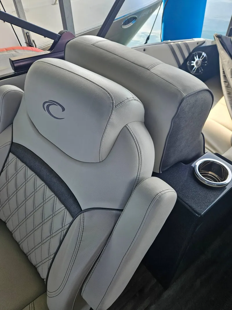 Slide: The Image of Luxurious 2018 Crest Savanagh boat seats with cup holder and elegant stitching. - 7