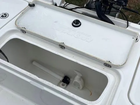 Slide: The Image of Open storage compartment on a 2004 Triton 240 LTS boat. - 6