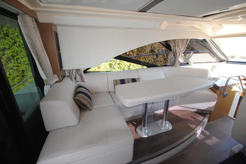 Slide: The Image of Luxurious interior of 2017 Sea Ray Sundancer 510 yacht with elegant seating and dining area. - 15