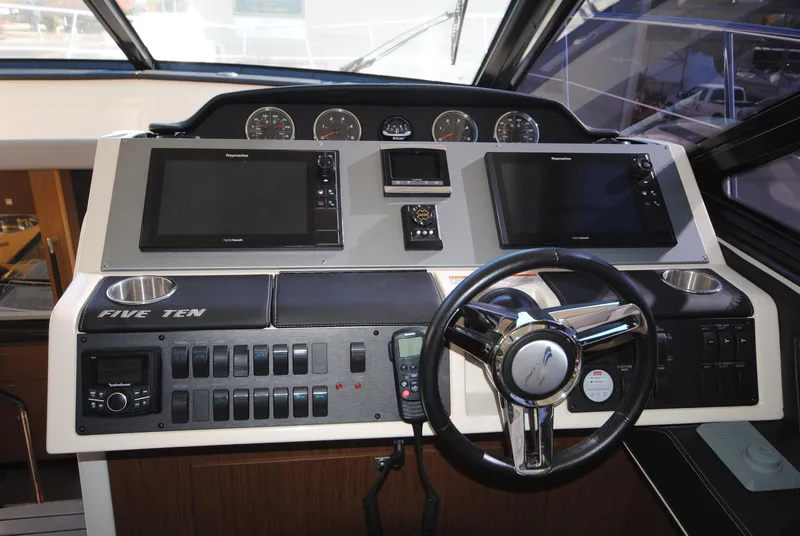 Slide: The Image of 2017 Sea Ray Sundancer 510 helm with dual displays and modern controls. - 17