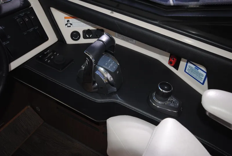 Slide: The Image of 2017 Sea Ray Sundancer 510 helm controls with joystick and throttle. - 18